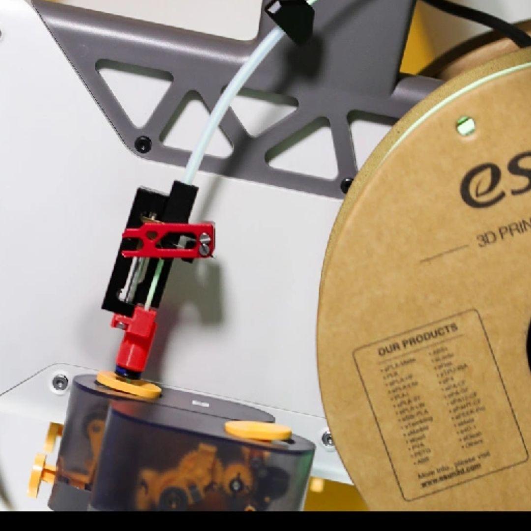 Filament cutter integrated with Bambu Lab AMS Lite feed path (mounting and routing example)