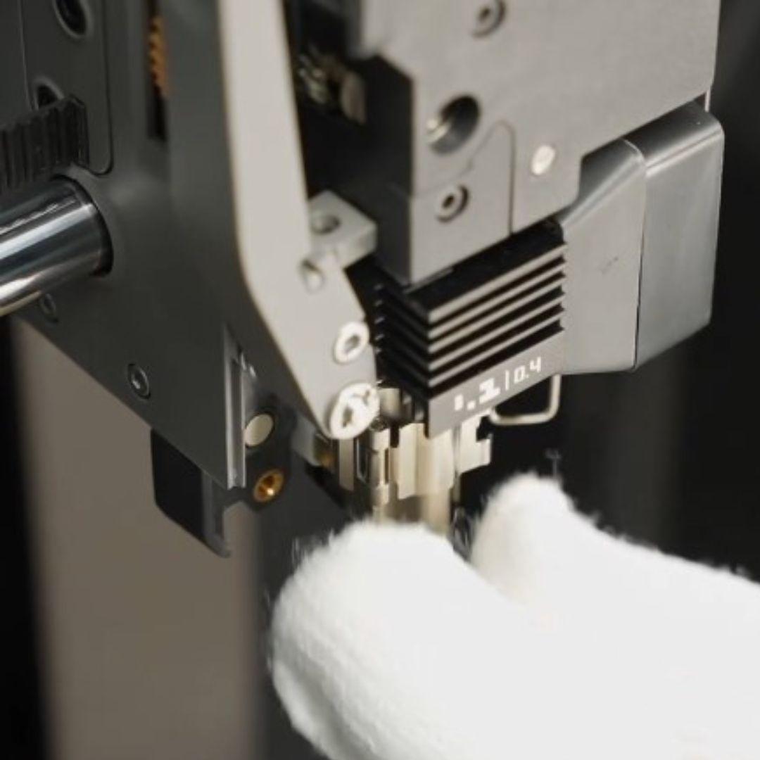 Bambu P2S hotend removal with safety gloves (quick-swap latch opened)