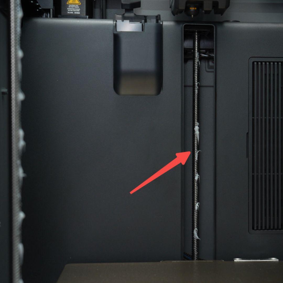Lubricant grease applied in a thin, even layer on the Bambu Lab P2S Z-axis lead screw during maintenance (wipe off excess after application)