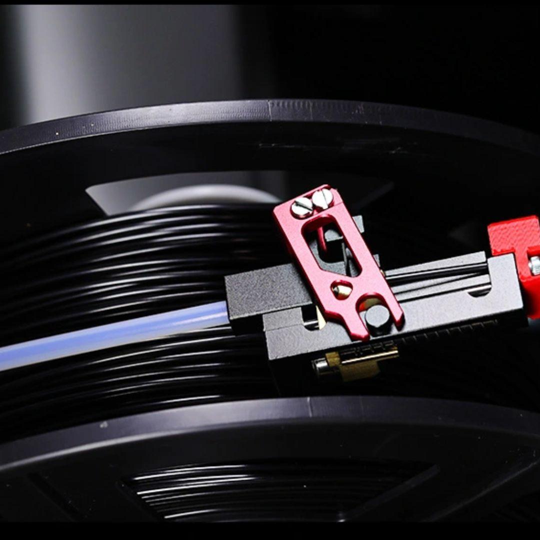Filament cutter installed on the filament path, showing how it sits inline to catch high tension