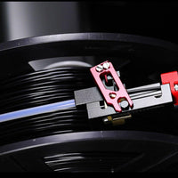 Filament cutter installed on the filament path, showing how it sits inline to catch high tension