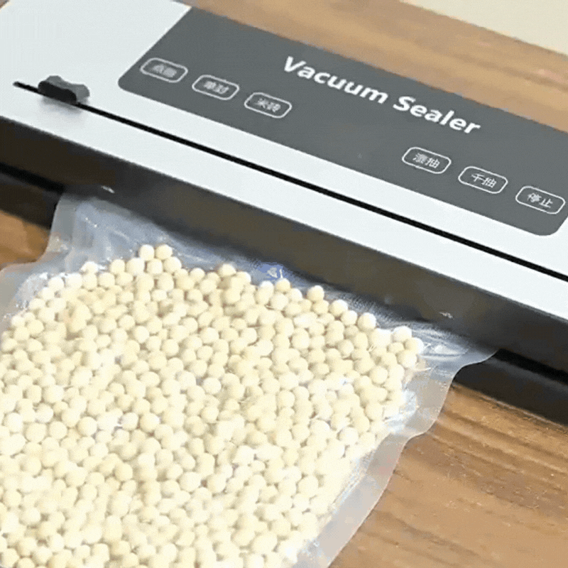  Filament vacuum sealer removing air from a bag of molecular sieve desiccant for dry filament storage.