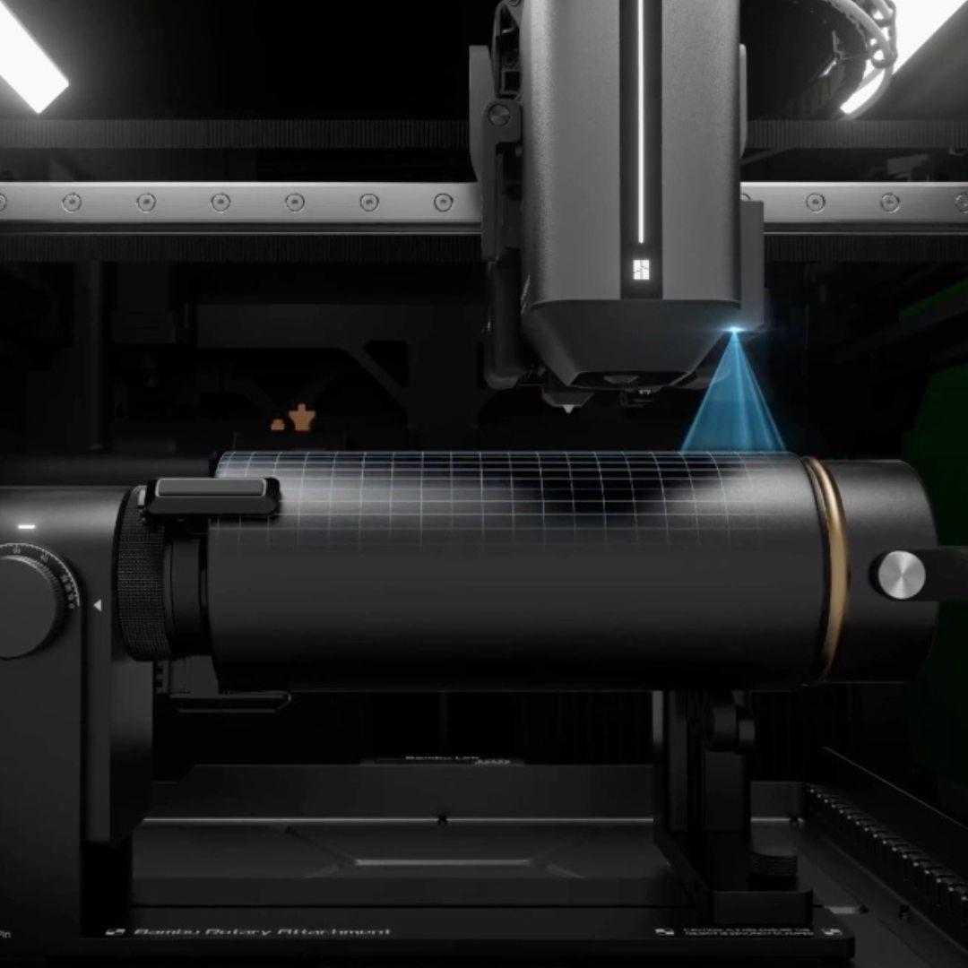Rotary attachment uses LiDAR for automatic measurement, calibration, and preview alignment on a cylindrical workpiece.